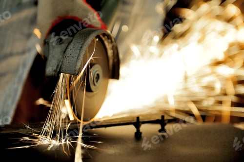 Preview: Worker cutting metal with grinder