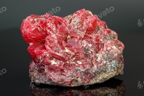 Preview: macro mineral stone Rhodochrosite on a black background