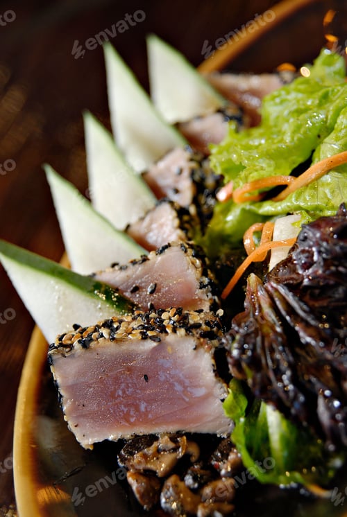 Preview: Vertical closeup of an Asian salad with tuna and vegetables