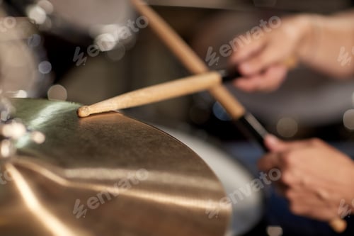 Preview: male musician playing drums and cymbals at concert