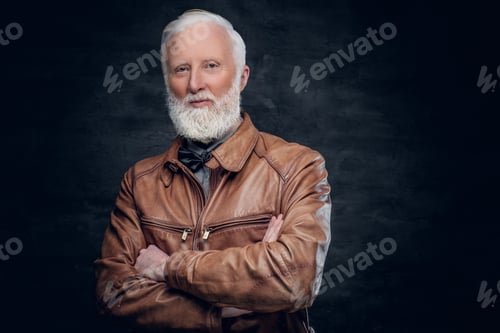 Preview: Confident elderly man dressed in brown leather jacket