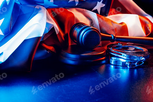 Preview: Gavel, handcuffs and american flag on dark background