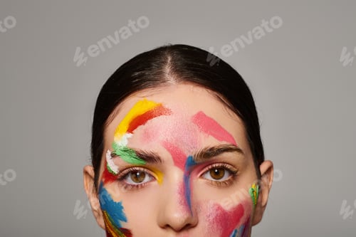 Preview: Vibrant face art showcases youthful beauty and artistic expression in a stylish setting
