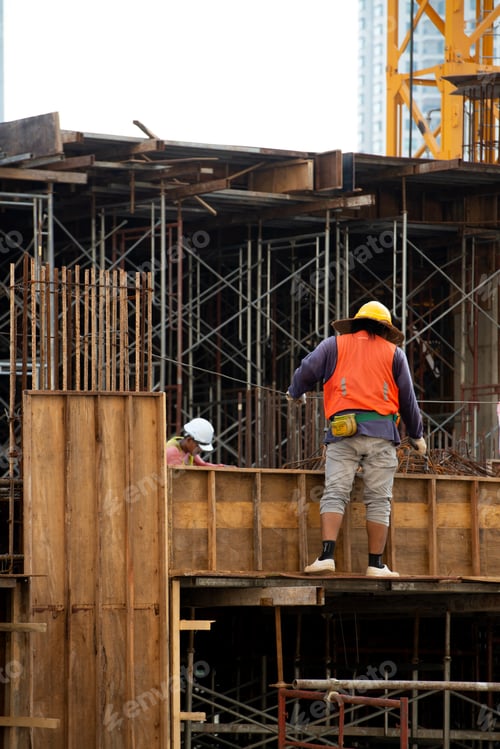 Preview: Construction workers fabricating steel reinforcement bar at the construction site