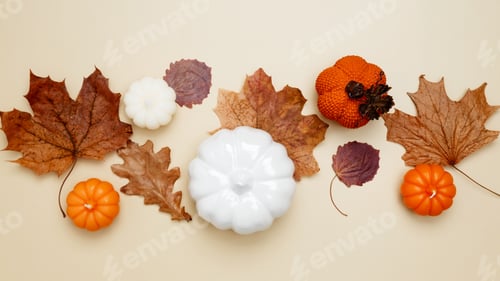 Preview: Autumn composition with maple leaves, decorative pumpkins and candles. Top view. Copy space