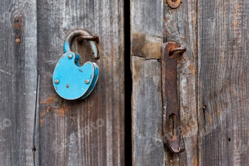 Preview: Blue old rusty unlocked padlock on wooden door