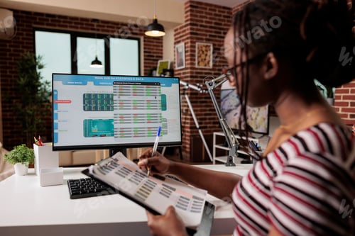 Preview: Woman analyzing statistics on computer screen