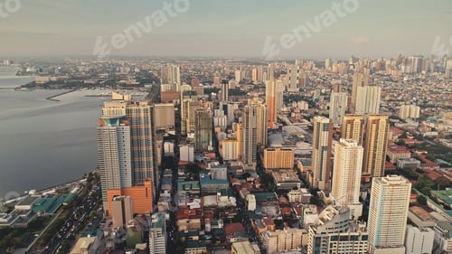Preview: Modern cityscape at ocean bay aerial. High scyscrapers and block buildings at sea coast. Green park