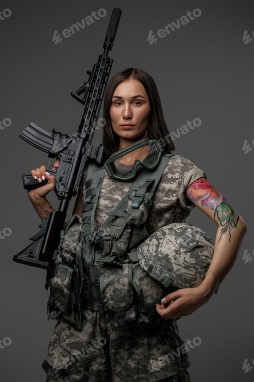 Preview: Attractive soldier woman with rifle against dark background