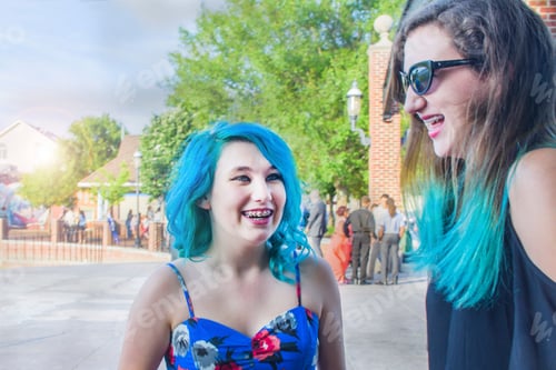 Preview: Portrait of two female friends with blue hair, laughing