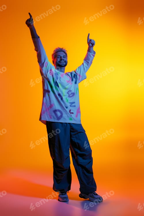 Preview: Joyful expression of youth and style under vibrant lights in a creative studio setting
