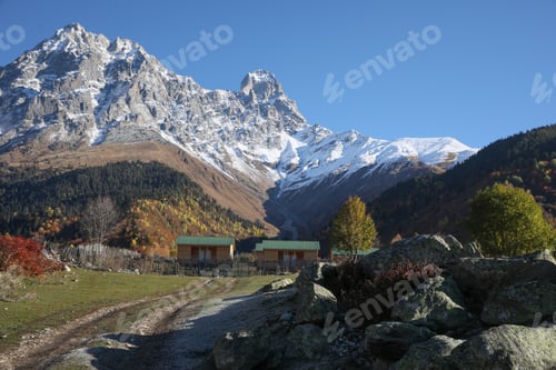 Preview: Picturesque view of empty pathway near stones in mountains on sunny day