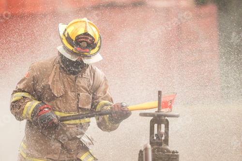 Preview: A firefighter in protective gear swings an axe while performing an emergency response