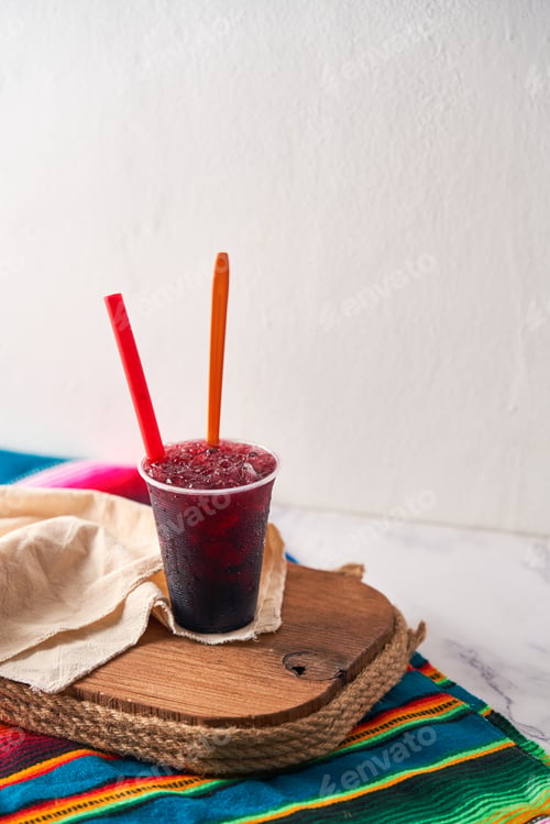 Preview: A vibrant red raspado, raspadilla or cholado ice summer treat or dessert