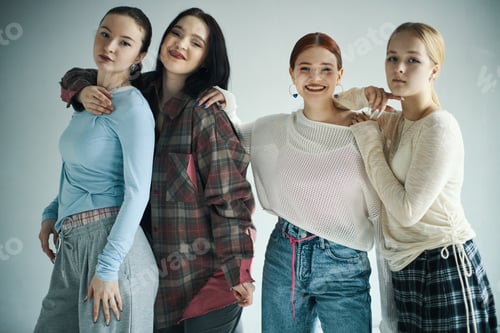 Preview: Portrait of Four Diverse Young Women Posing Inside Room