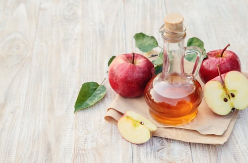 Preview: Apple cider vinegar in a bottle. Selective focus.