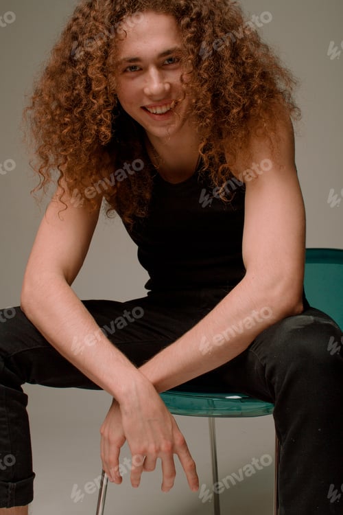 Preview: Attractive And Stylish Guy With Curly Hair And A Sports Figure
