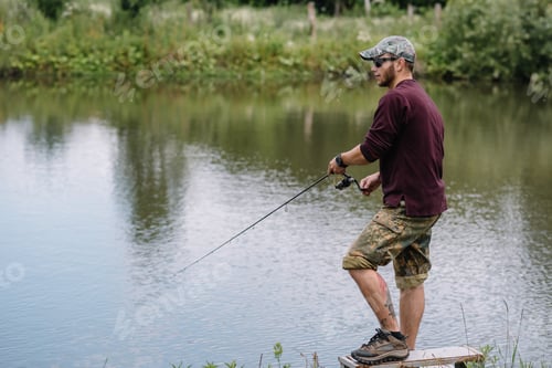 Preview: Fishing in river.A fisherman with a fishing rod on the river