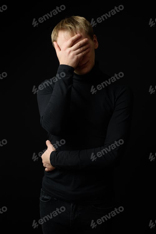 Preview: Close up portrait of a young man in a white shirt and black tie.