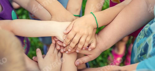 Preview: Children's hands together, street games. Selective focus.