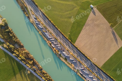 Preview: Top down aerial view of highway interstate road with fast moving traffic and parking lot