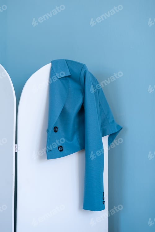 Preview: blue jacket hanging on a hanger