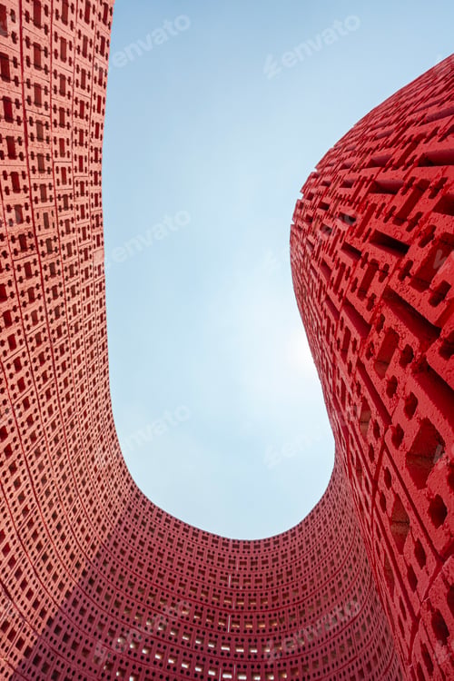 Modern Red Brick Architecture Against Blue Sky