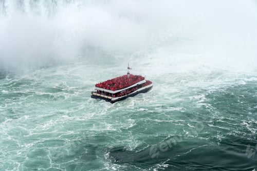 Preview: A tour boat cruises towards to mist at the base of the Horseshoe Falls in Niagara Falls Ontario.