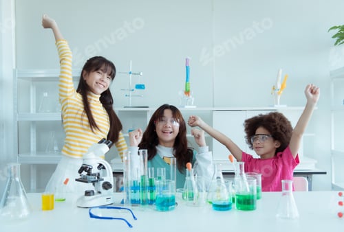 Preview: In the science classroom, an Asian child scientist experimenting with scientific formulas
