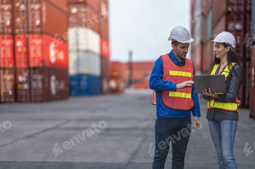 Preview: workers in high visibility safety gear and hard hats discuss operations