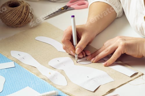 Preview: Sewing patterns for future toy or clothes. Cropped designer, seamstress pin, make paper sewing