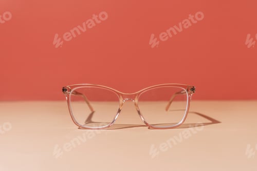 Preview: Pink eyeglasses on pastel background. Myopia