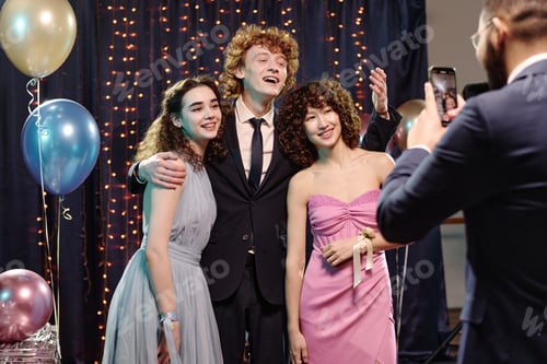 Preview: Group of Teenagers Posing Together during Formal Event Celebration