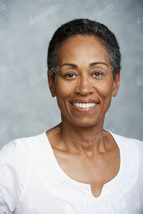 Preview: Smiling woman in a white blouse posing for a portrait