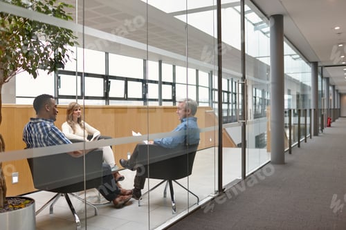 Preview: Businessmen and woman talking at conference room meeting