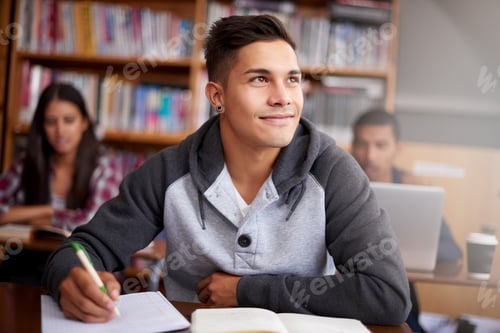 Preview: Smiling Young Adult Studying in the Library