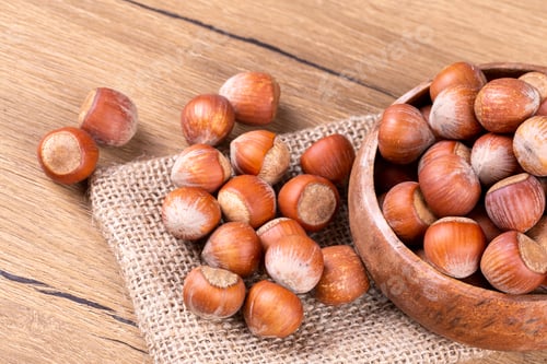 Preview: Shelled Hazelnuts is important for health on the wooden background