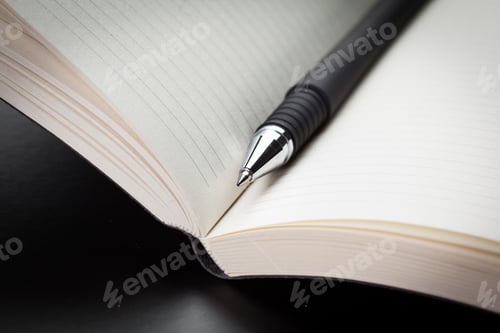 Preview: blank notebook and pen on the table