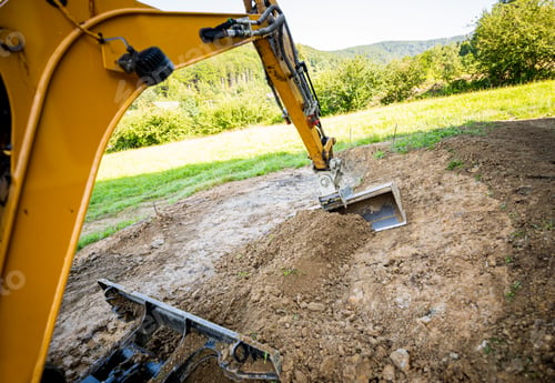 Preview: Mini excavator digging preparing ground under home garden
