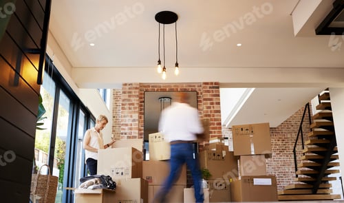 Preview: Ready, steady, pack. Shot of a mature couple unpacking boxes on moving day.