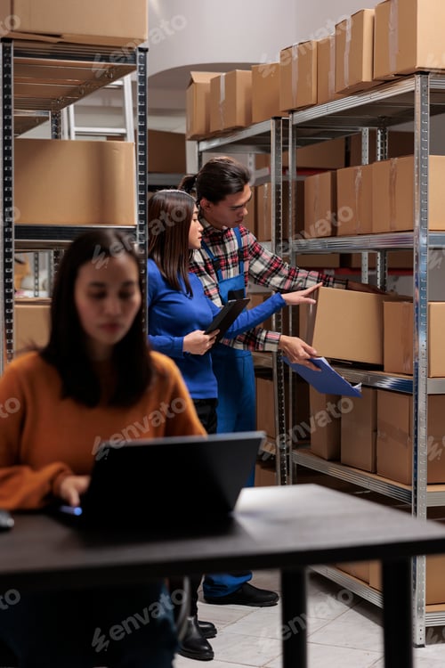 Preview: Postal storehouse employees managing order picking and shipping operation
