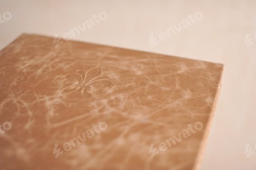 Preview: Composition of photobooks in natural brown leather . Fragment of a photobook binding