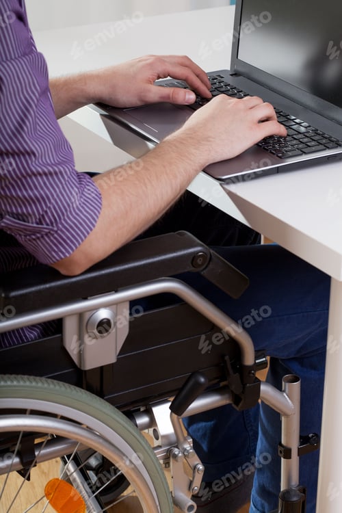 Preview: Man On Wheelchair Working On Laptop, Vertical