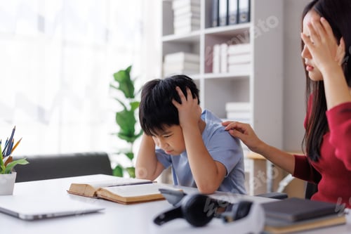 Preview: Asian mother comforting stressed son having difficulty studying