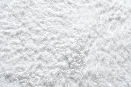 Preview: Close-up texture of soft fluffy white towel material perfect for design