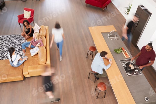 Preview: Overhead Shot Of Friends Cooking Meal And Relaxing Together