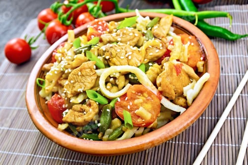 Preview: Noodles wok Thai in clay plate on bamboo