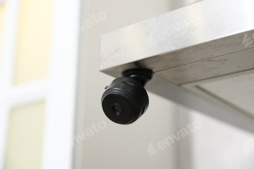 Preview: Hidden spy camera on kitchen hood, closeup. Space for text