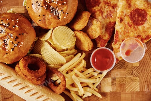 Preview: Unhealthy and junk food. Different types of fast food on the table, closeup