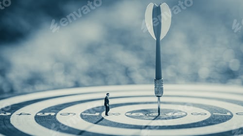 Preview: Businessman standing lookup red dart arrow hitting target centre dartboard on sunset background. Bus